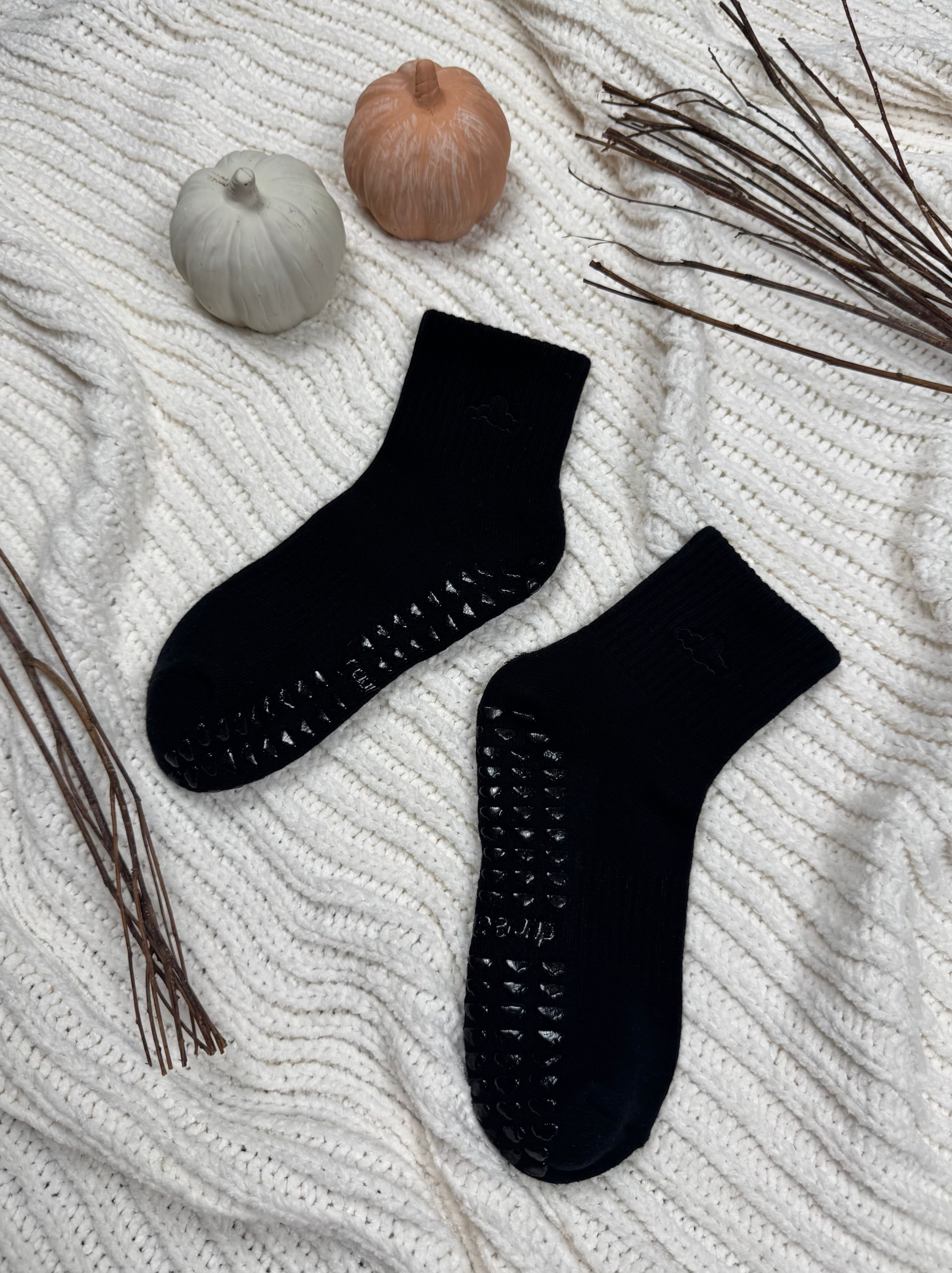 Black grip socks with pumpkin and branch decorations