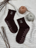 Brown grip socks with teddy bear design, pumpkin decorations