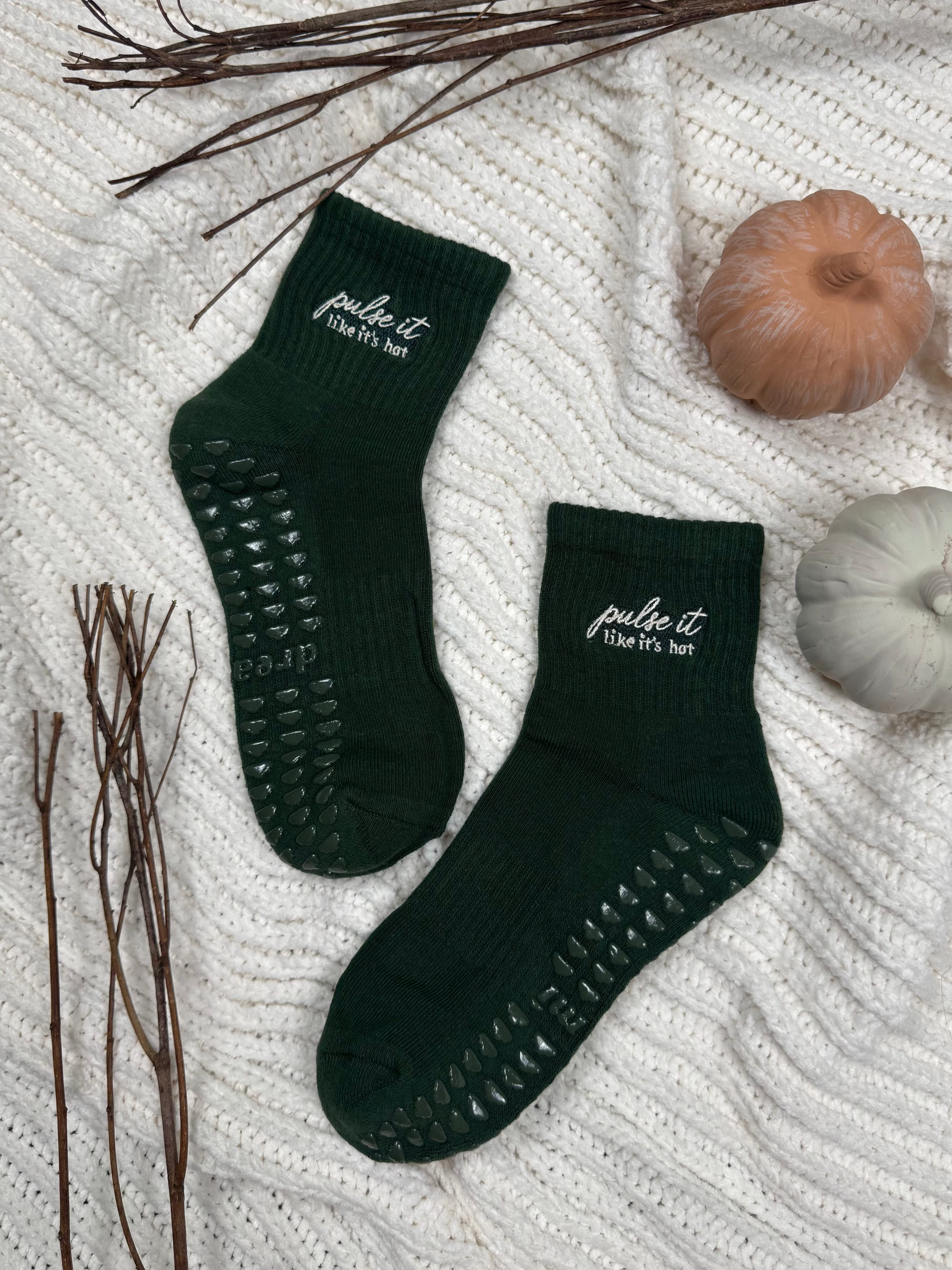 Forest green socks with "pulse it like it's hot" embroidered design